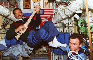 <a href="sts-74-photo-25.htm">Hadfield plays guitar on Mir</a> 